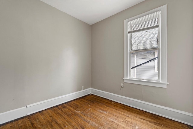 1718 W Washington St Unit 1720, Milwaukee, WI 53204 - spare room with baseboards, wood-type flooring, and healthy amount of natural light