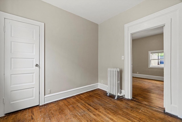 1718 W Washington St Unit 1720, Milwaukee, WI 53204 - spare room featuring radiator, hardwood / wood-style floors, and baseboards