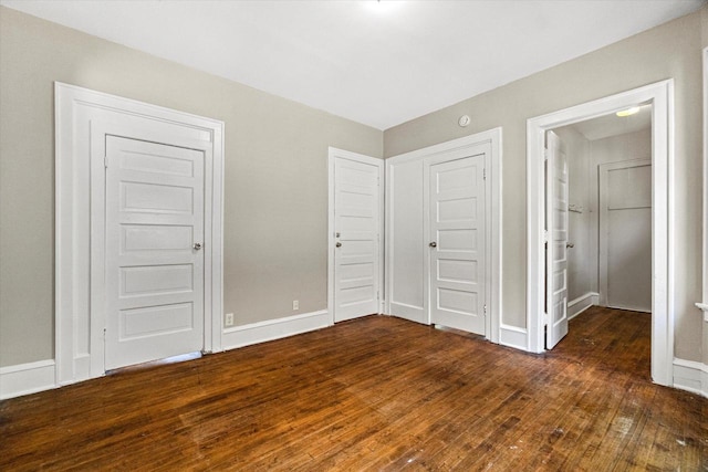 1718 W Washington St Unit 1720, Milwaukee, WI 53204 - unfurnished bedroom featuring hardwood / wood-style flooring and baseboards