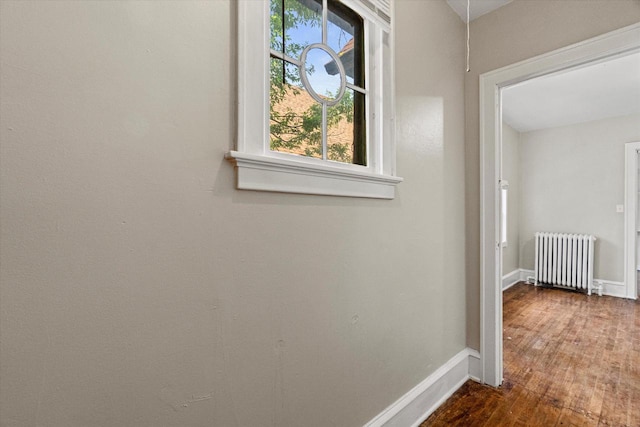 1718 W Washington St Unit 1720, Milwaukee, WI 53204 - hall with radiator, baseboards, and hardwood / wood-style floors