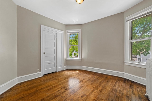 1718 W Washington St Unit 1720, Milwaukee, WI 53204 - unfurnished room featuring baseboards and hardwood / wood-style flooring