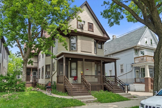 1718 W Washington St Unit 1720, Milwaukee, WI 53204 - american foursquare style home with a porch and cooling unit