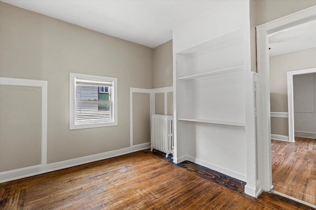 1718 W Washington St Unit 1720, Milwaukee, WI 53204 - unfurnished bedroom featuring radiator and hardwood / wood-style flooring