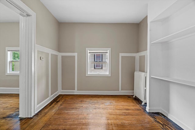 1718 W Washington St Unit 1720, Milwaukee, WI 53204 - unfurnished room with radiator heating unit, wood-type flooring, and baseboards