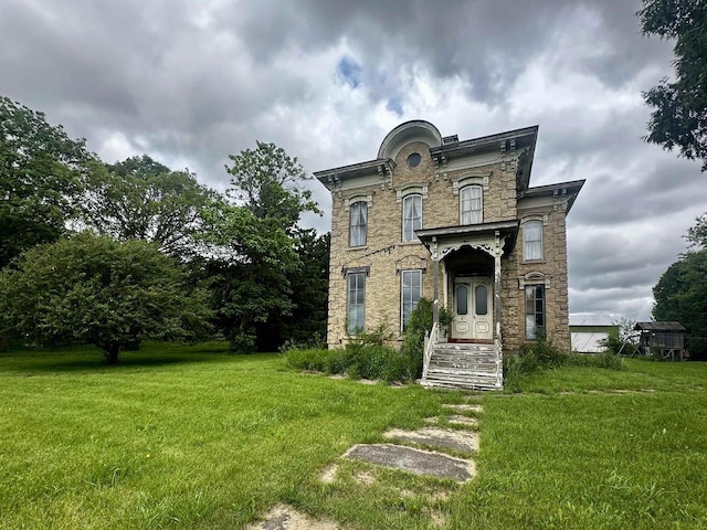 4760 State Rd 91, Oshkosh, WI 54904 - italianate-style house featuring a front lawn and stone siding