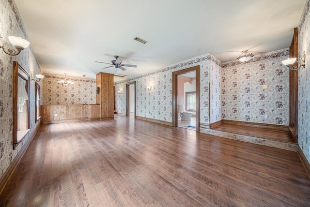 4760 State Rd 91, Oshkosh, WI 54904 - unfurnished living room with wallpapered walls, wood finished floors, ceiling fan, and a wainscoted wall