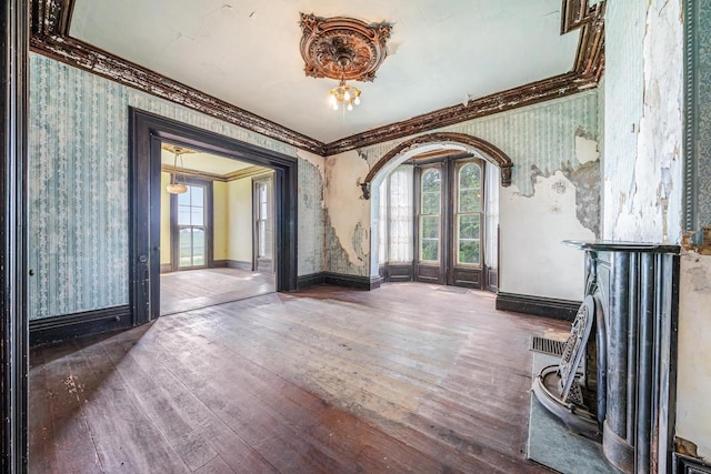 4760 State Rd 91, Oshkosh, WI 54904 - foyer entrance featuring wallpapered walls, hardwood / wood-style floors, crown molding, and baseboards