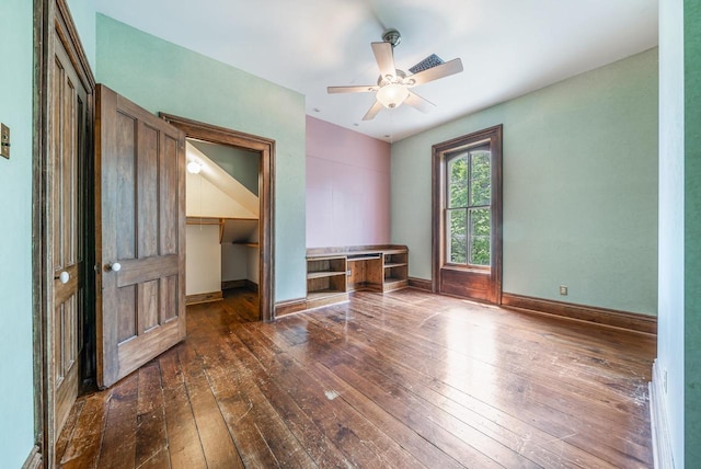 4760 State Rd 91, Oshkosh, WI 54904 - empty room with dark wood-style floors, ceiling fan, and baseboards