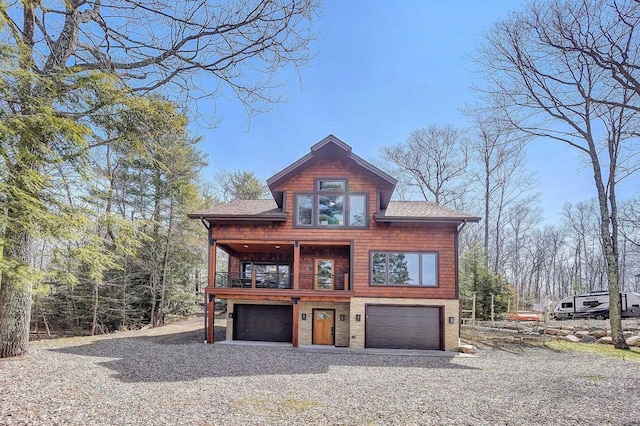 3857 Lake Lucerne Dr, Crandon, WI 54520 - rustic home with a garage, roof with shingles, driveway, and a balcony