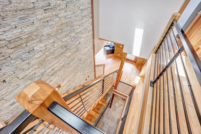 3857 Lake Lucerne Dr, Crandon, WI 54520 - staircase featuring wood finished floors and a towering ceiling