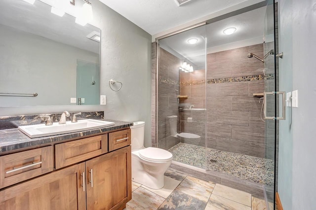 3857 Lake Lucerne Dr, Crandon, WI 54520 - full bathroom with toilet, vanity, and a stall shower