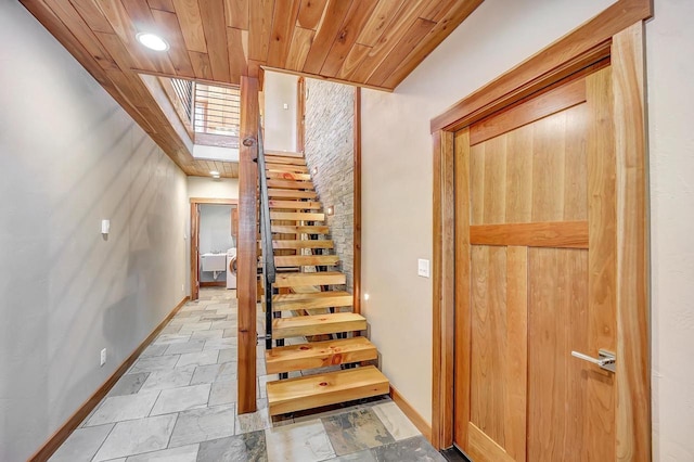 3857 Lake Lucerne Dr, Crandon, WI 54520 - stairs featuring baseboards, a skylight, and wood ceiling