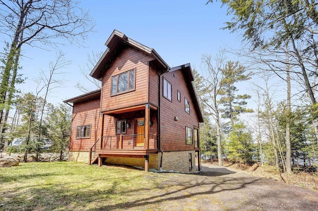 3857 Lake Lucerne Dr, Crandon, WI 54520 - rear view of property with a yard
