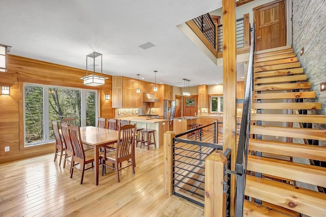 3857 Lake Lucerne Dr, Crandon, WI 54520 - dining room with light wood-style flooring and wooden walls