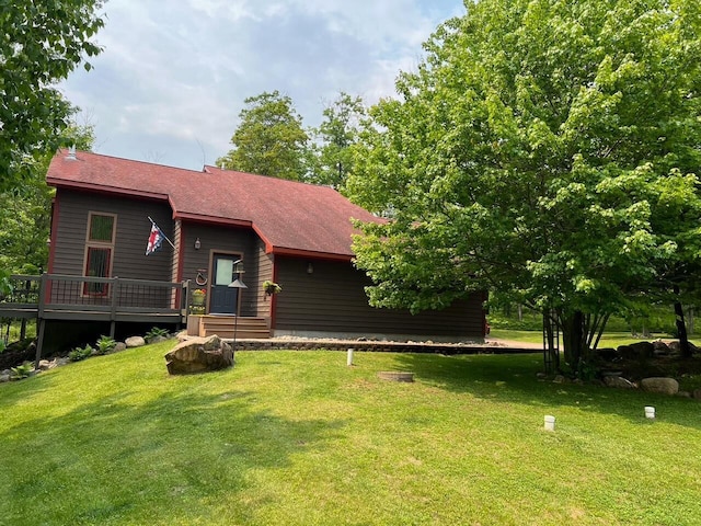 23999 Cherryville Rd, Ashland, WI 54806 - view of front of house with a front yard, a wooden deck, and roof with shingles