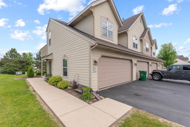 2639 W Honadel Blvd, Oak Creek, WI 53154 - view of home's exterior with a garage, driveway, a lawn, and a shingled roof