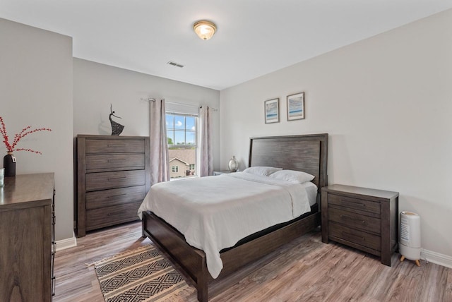 2639 W Honadel Blvd, Oak Creek, WI 53154 - bedroom with light wood-style flooring and baseboards