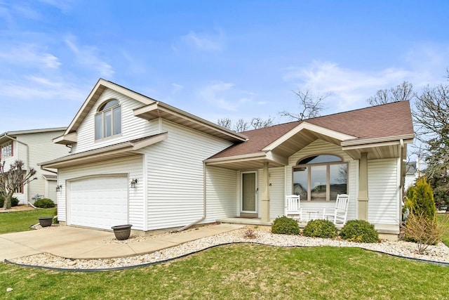 7338 Blue Maple Trl, Madison, WI 53719 - view of front of home featuring covered porch, concrete driveway, a garage, and a front yard