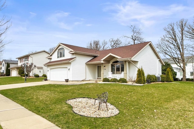 7338 Blue Maple Trl, Madison, WI 53719 - view of front of property featuring driveway, a front yard, an attached garage, roof with shingles, and a porch
