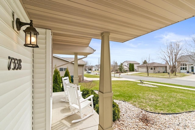 7338 Blue Maple Trl, Madison, WI 53719 - porch with a yard and a residential view