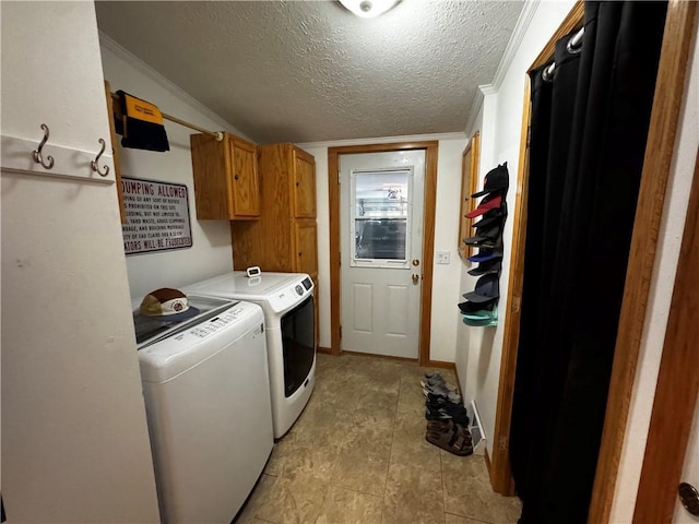 1311 W Northstar Ln, Eau Claire, WI 54703 - laundry area with washing machine and dryer, cabinet space, a textured ceiling, and ornamental molding