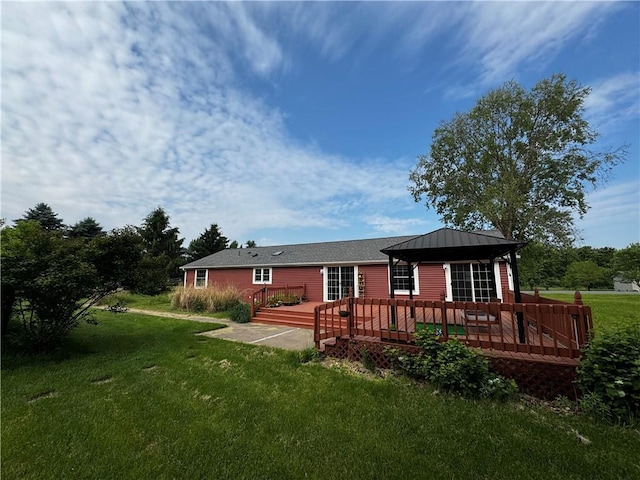 1311 W Northstar Ln, Eau Claire, WI 54703 - rear view of house featuring a gazebo, a yard, a wooden deck, and metal roof