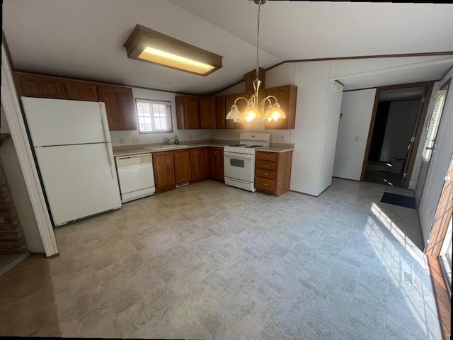 N2639 County Road Z Unit B19, Dousman, WI 53118 - kitchen with white appliances, lofted ceiling, light countertops, a chandelier, and decorative light fixtures