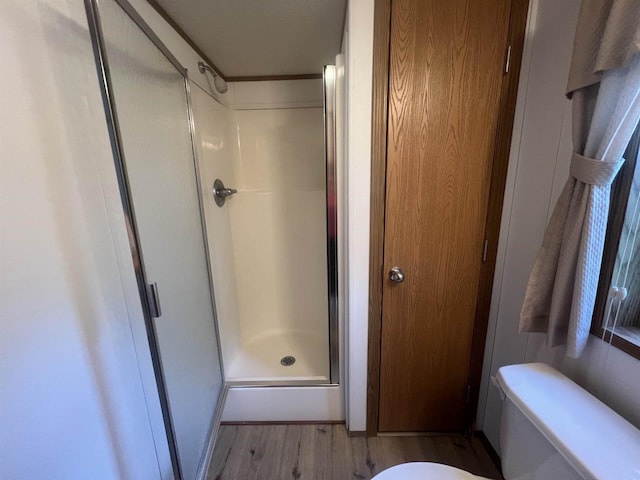 N2639 County Road Z Unit B19, Dousman, WI 53118 - full bathroom with a stall shower, wood finished floors, and toilet