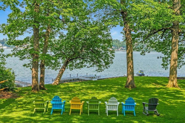 W347N6122 Rd I, Oconomowoc, WI 53066 - view of grassy yard with a water view and a boat dock