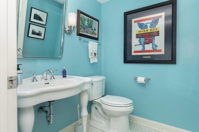 W347N6122 Rd I, Oconomowoc, WI 53066 - bathroom with toilet, baseboards, and tile patterned floors