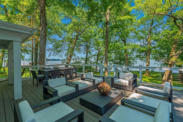 W347N6122 Rd I, Oconomowoc, WI 53066 - wooden deck featuring an outdoor living space, outdoor dining area, and a water view