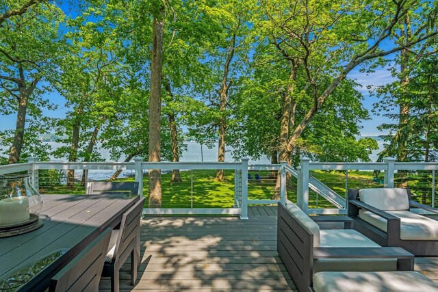W347N6122 Rd I, Oconomowoc, WI 53066 - wooden terrace featuring outdoor lounge area and a water view
