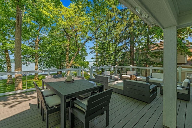 W347N6122 Rd I, Oconomowoc, WI 53066 - wooden terrace with an outdoor living space, outdoor dining space, and a water view