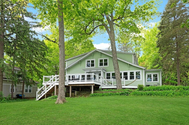 W347N6122 Rd I, Oconomowoc, WI 53066 - back of property with a lawn, a wooden deck, and stairway