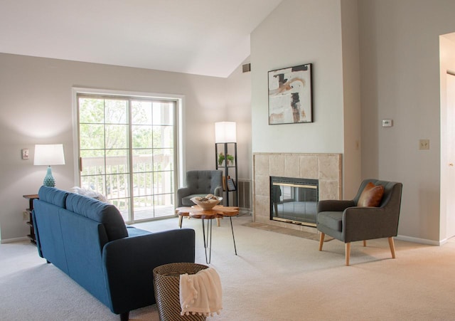 1904 Parknoll Ln, Port Washington, WI 53074 - living room featuring carpet floors, a tile fireplace, baseboards, and high vaulted ceiling