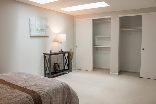 1904 Parknoll Ln, Port Washington, WI 53074 - carpeted bedroom with a skylight, two closets, and baseboards