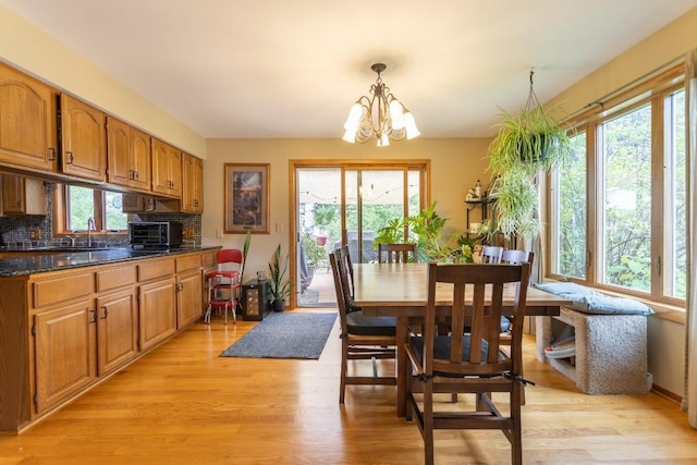 1207 Lark St, Merrill, WI 54452 - dining room with a chandelier and light wood-type flooring