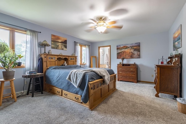 1207 Lark St, Merrill, WI 54452 - carpeted bedroom with baseboards, a ceiling fan, and ensuite bathroom