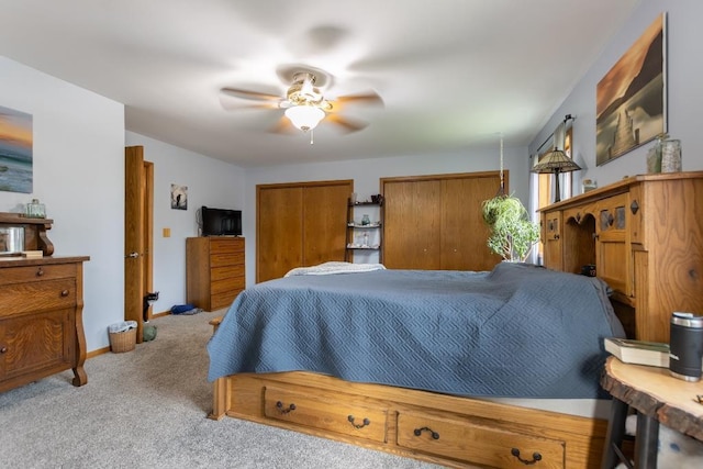 1207 Lark St, Merrill, WI 54452 - bedroom featuring carpet, multiple closets, baseboards, and a ceiling fan