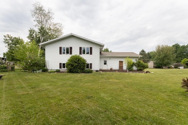 1207 Lark St, Merrill, WI 54452 - back of property featuring a lawn