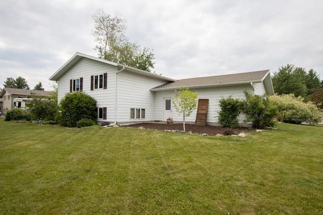 1207 Lark St, Merrill, WI 54452 - back of house with a lawn