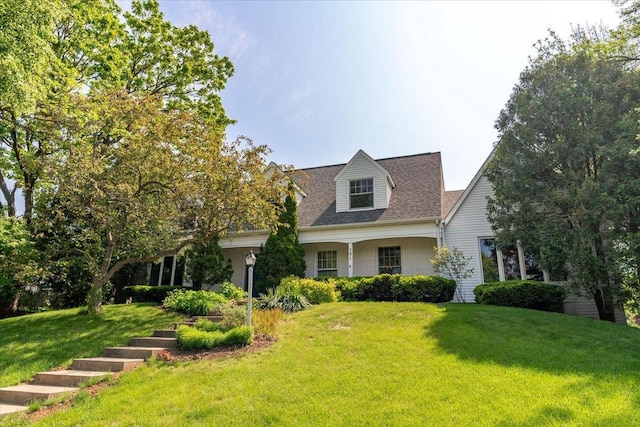 101 Everglade Dr, Madison, WI 53717 - cape cod house featuring a front lawn and roof with shingles