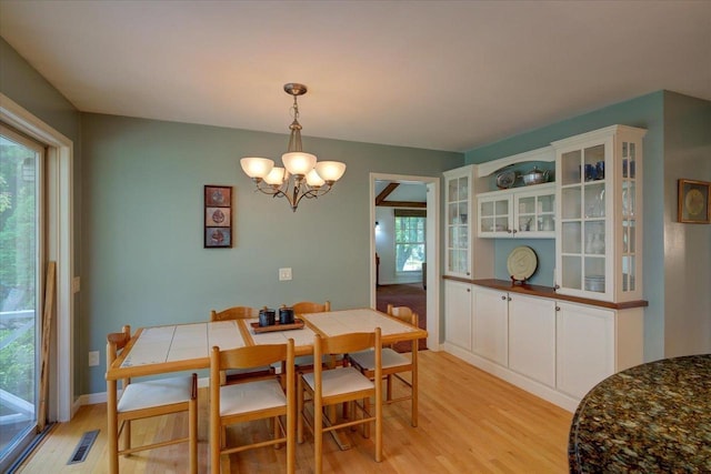 101 Everglade Dr, Madison, WI 53717 - dining area featuring light wood-style floors, a chandelier, and baseboards