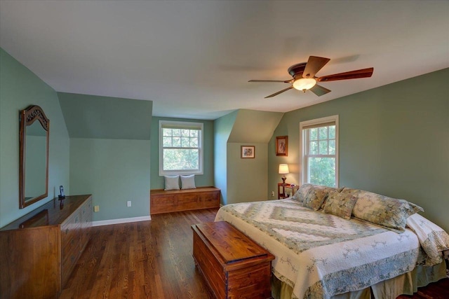 101 Everglade Dr, Madison, WI 53717 - bedroom featuring dark wood-type flooring, multiple windows, vaulted ceiling, a ceiling fan, and baseboards
