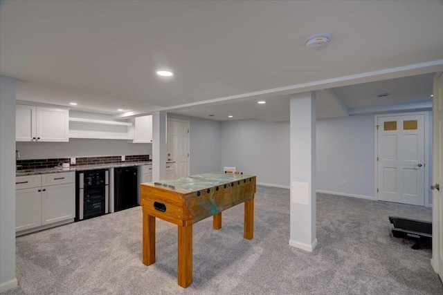 101 Everglade Dr, Madison, WI 53717 - playroom with wine cooler, carpet floors, bar with sink, recessed lighting, and baseboards