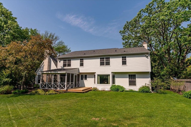101 Everglade Dr, Madison, WI 53717 - rear view of house featuring a sunroom, a chimney, a yard, and a deck