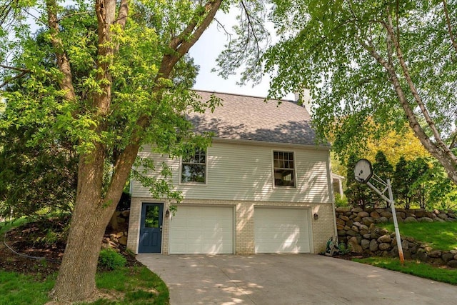 101 Everglade Dr, Madison, WI 53717 - view of front facade featuring an attached garage, brick siding, driveway, and roof with shingles