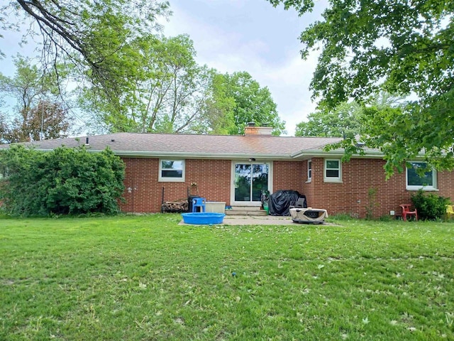 2048 County Road Q, Pound, WI 54161 - rear view of property with brick siding, a yard, and a chimney