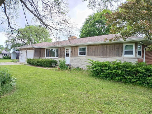 2048 County Road Q, Pound, WI 54161 - ranch-style home featuring a chimney, a garage, a front yard, concrete driveway, and stone siding