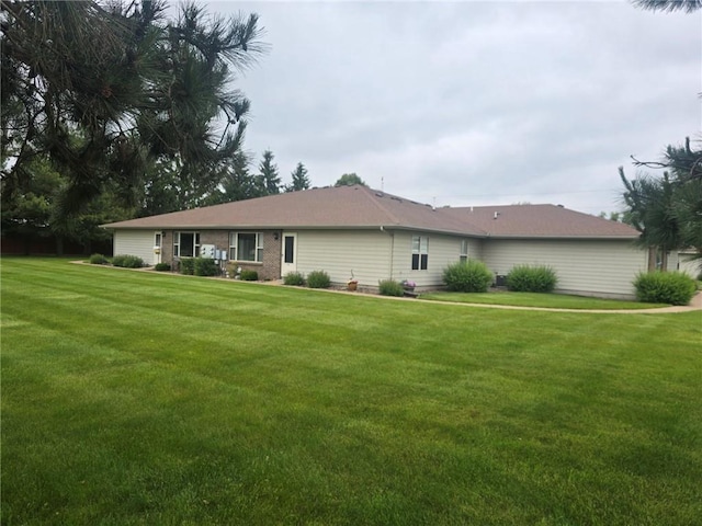 318 Frenette Dr Unit 2, Chippewa Falls, WI 54729 - view of front facade featuring a front lawn